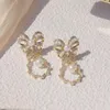Bengelen kroonluchter Koreaanse mode -sieraden 14K echt goud vergulde koper ingelegde zirkoon oorbellen elegante boog dames bruiloftsfeest oorbellen