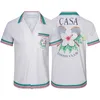 Casablanca 2022 New Ping Pong Classic Mens Shirts Prairie Green Print Usisex British Silk Shirt Shirt Short Sleeve Designer Tees Womens Summer Summer Beach Tops
