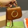 Mini bolsas bolsas Bolsa de corpo transversal Mulheres metal fivela de couro genuíno Canvas de moeda de moeda Hardware de hardware letra de intertravamento Hasp Sacos de ombro pendente de ombro com caixa