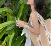 Hot Sell Style Style Straw Locen Bag 2022 New Summer Summer عالية السعة الترفيهية حقيبة محمولة منسوجة للنساء حقيبة الكتف على الشاطئ 221K