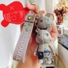 Ключевые кольца бренда Cartoon Half Skull Bearge Bear Bear Caychain Fashion Animal Keyring автомобиль ключевые цепочки держатель держателя сумки подвесной шарм ключ для M4166540