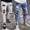 Hip Hop as calças dos homens High End Jeans apertadas Pés Buraco Cotton Badges Magro lápis Slim Fit Branco Azul respirável confortável