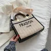 Luxe ontwerpers handtas tote schouderkoppelingszakken crossbody boodschappentas porrentes letters zomer stro breien tas een handvat