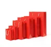 red paper bags with handles