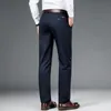 SHAN BAO Pantaloni elasticizzati in cotone dritto aderenti di marca primaverile Pantaloni slim in colore puro da ufficio per uomo casual da lavoro classico 220330