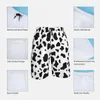 Short homme noir blanc vache imprimé planche motif tendance taches Animal homme confortable plage pantalon court Design grande taille troncs
