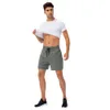 Vêtements Pantalons survêtement Hommes Sports d'été Shorts de couleur unie Fitness en plein air Course à pied Haute Élastique Respirant Séchage rapide Pantalon à cinq points Joggers