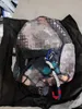 2021ファッションスタイルの落書きプリントロープバッグが多色のプリントキャンバスバックパックスクールバッグで刺繍されたロープバッグ