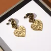 Bump texture love pêche coeur boucles d'oreilles étalons rétro tempérament haut de gamme marée de mode cool fashion street tout-correspondant bijoux accessoires