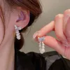 Ciondola gli orecchini dell'arco dello zircone della perla del candeliere Orecchini della personalità di Dongdaemun della Corea