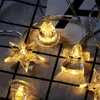 Strings Christmas Decoration Star Bells e Angel LED String Lights Bather com árvores decoradas