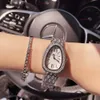 Роскошные женские часы модельер -дизайнер -змеи овальная римская бриллиантовая дама водонепроницаемые браслет Quartz Студенты Weame Watch jgfj