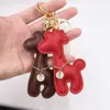 PU Cuir Girafe Porte-clés Marque Animal Pendentif Porte-clés Anneaux Accessoires Design De Mode Porte-clés De Voiture Titulaire Femmes Hommes Bande Dessinée Sac Charmes Mignon Bijoux Cadeaux