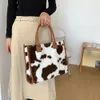 Borse con manico superiore del progettista di marca per le donne Borse a tracolla in peluche con stampa leopardata di mucca retrò di design di lusso Borse a tracolla shopper da donna di design di lusso Pelliccia sintetica Nuovo