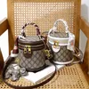 Borse Outlet piccole donne 2022 nuovo senso del design borsa a secchiello portatile stile esplosione Borsa a tracolla singola