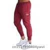 Nowe pułapki joggery dresowe mężczyźni elastyczne talii zwykłe spodni