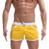 Été plage porter nouveaux hommes sport conseil shorts mode homme et femmes shorts décontractés mince flèche pantalon Y220420