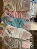 Vente en gros hommes femmes chaussettes sport hiver automne fleur animal impression dames chaussette broderie coton filles