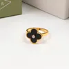 Anillo de amor clásico de un solo diamante de Color negro y dorado, flor de cuatro hojas, anillos de pareja de acero inoxidable de marca de lujo para mujer y mujer