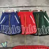 Rhude ショーツ男性女性 Rh ショートパンツメッシュズボンロングイエロー巾着スポーツトレーニングビーチ 2rl9