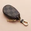 Portachiavi per auto Portachiavi Anelli Fiore marrone Plaid PU Pelle Portachiavi in metallo dorato Porta ciondoli Ciondoli Design della moda Sacchetti Jewelr179R