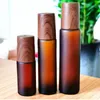 5 ml, 10 ml, 15 ml Roll-on-Flaschen aus bernsteinfarbenem Glas, Holzmaserung, Kunststoffkappe, mattierte Parfümflasche für ätherische Öle mit Edelstahl-Rollerball