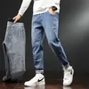 Hommes Plus velours épais jean ample hiver à la mode Hong Kong Style chaud sarouel mâle marque polaire Denim pantalon 220328