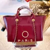 Bolsas femininas luxuosas Bolsas de praia Designers Metal Letter Badge Tote Bolsa de noite Bolsa de couro de corpo pequeno Bolsa de corrente feminina grande Mochila YDZO 50% Liquidação