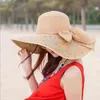 2022 جديد أزياء امرأة سترو قبعة bowknot الشريط الشمس القبعات واسعة حافة عارضة الإناث الصيف طوي الظل الشاطئ قبعة مكافحة uv كاب G220304