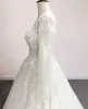 Splendidi abiti da sposa in pizzo Abito Brdail Applique Una linea Bottoni ricoperti Indietro Gioiello Collo Maniche lunghe Country Custom Made Plus Size Robe De Mariee