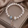 ナチュラル淡水真珠のブレスレットの女性中国のスタイルの幸運の譲渡長寿ロックペンダントジュエリーガールフレンド工場の価格良い品質