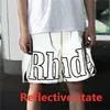 Шорты Rhude Дизайнер серого цвета мужчины женщины отражающий эффект внутри Tag Us/Size Размер негабаритного колена UK X1116 Высокое качество