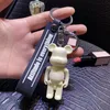 2022 nouveau monochrome violent ours porte-clés mignon créatif dessin animé amoureux clé pendentif poupée sac porte-clés