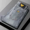 Spring jeans voor heren Koreaanse versie Medium taille kleine voet slanke fit licht extravagante katoenen elastische veelzijdige jeugdbroek
