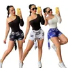 Roupas de roupas de verão Designer Ruos de rastreio mulheres duas peças Conjunto de uma camiseta de ombro, traje esportivo de maiúsculas impressão de moda k157