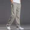 Męskie dżinsy męskie dorywczo bawełniane spodnie Cargo męskie kieszenie luźne proste spodnie elastyczne spodnie robocze marka Fit biegaczy męskie bardzo duże rozmiary 6XL 220920