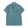 남자 티셔츠 패션 라펠 셔츠 여름 야외 느슨한 신선한 캐주얼 인쇄 버튼 짧은 슬리브 하와이 비치 파티 스타일 셔츠