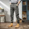 Calças masculinas de estilo coreano Men jeans Jeans Spliced ​​Designer Cargo casual macacão de rua de rua Hip Hop Harém HAREMERS HOLEMEN NAOM