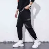 Heren vrachtbroek kpop streetwear reflecterende letters joggers mannen broek harembroek casual mannen kleding elastische taille mannen broek g220507