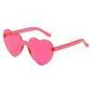 Gafas de sol Gafas de sol en forma de corazón Diseñador Candy Color Sin montura PC Gafas de viaje Ocean Sunscreen Shades European American Fashion Eyeglasses Eyewear