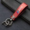 Anahtarlıklar yüksek dereceli karbon fiber desen araba anahtarlık logosu Peugeot için özel anahtarlık 308 407 508 2008 3008 AccessoriesKeychains205v