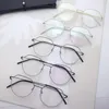 女性デザイナーのサングラス眼鏡レトロラウンド眼鏡光学メガネスクリューレス処理ステンレス鋼フレーム
