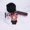 Llavero de oso de dibujos animados con accesorios de pompón Mujeres Niñas Llavero lindo PU Osos de cuero Diseñador Llavero de coche Titular de cadena de bolso de animal de moda 2022 INS