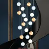 Lampes suspendues postmodernes rotatives en Duplex pour Grand escalier, luminaire de luxe pour Villa et appartement, boule de verre nordique Simple, longs lustres