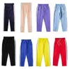 Pantaloni lunghi da uomo firmati Pantaloni da jogger a righe elastiche in vita Pantaloni da jogging da uomo casual invernali Pantaloni da pista da uomo in tinta unita di alta qualità Strisce laterali arcobaleno