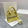 Bolso de mano bolsos de moda Shell para mujer un mensajero portátil pop cargo carta de gran capacidad color caramelo fábrica al por mayor 70% de descuento