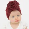 Morbido cotone tinta unita cappelli turbante berretti berretti copricapo con grande fiocco di fiori per neonate neonati bambini piccoli