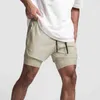 2022 Primavera Nuevo Color consistente dentro y fuera Pantalones cortos de doble capa Hombres Cortos Bolsillo incorporado Bermudas Pantalones cortos de playa de secado rápido Y220420