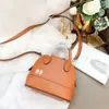 Luxurys Women handbags Designers bags classic shell tote bag one shoulder lady wallet High quality solid color letter handbag Messenger purse 2 sizes style good