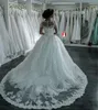 Nowe Dubai Eleganckie długie rękawy A-line sukienki ślubne Sheer Crew Neck Lace Applique z Kaliwami Vestios de novia suknie ślubne z guzikami